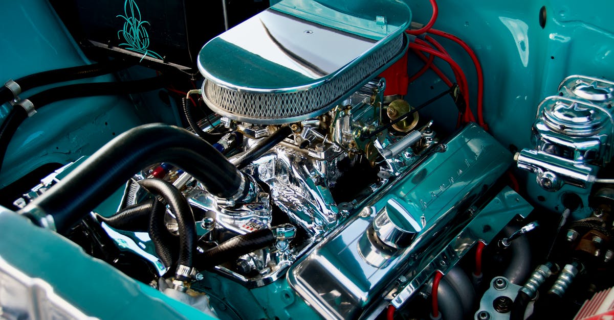 close up of a classic car engine with chrome details in a vintage vehicle high performance and rest