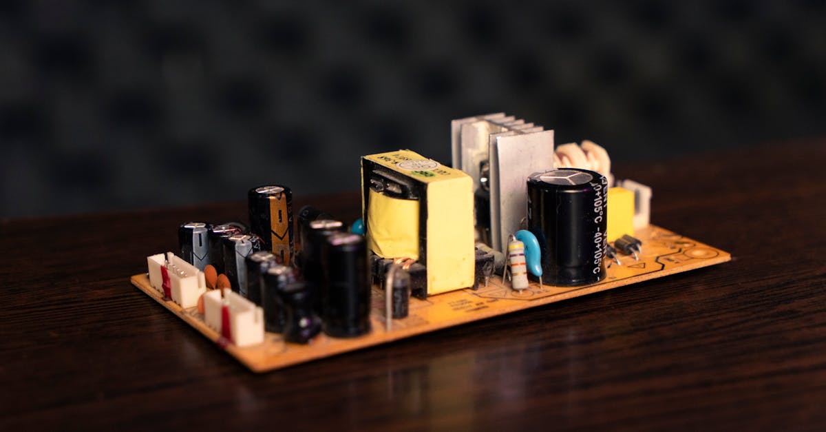 close up of an electronic circuit board showcasing capacitors resistors and transformers