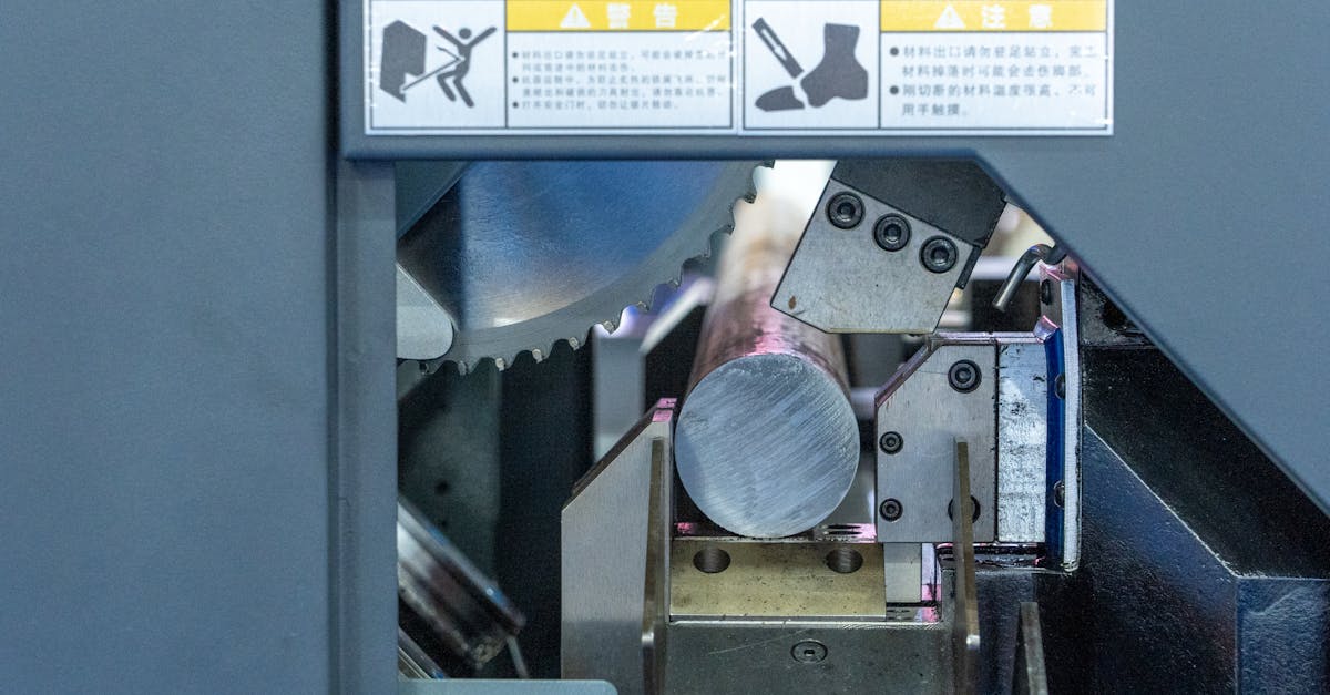 detailed view of a metal cutting machine in operation showcasing industrial machinery